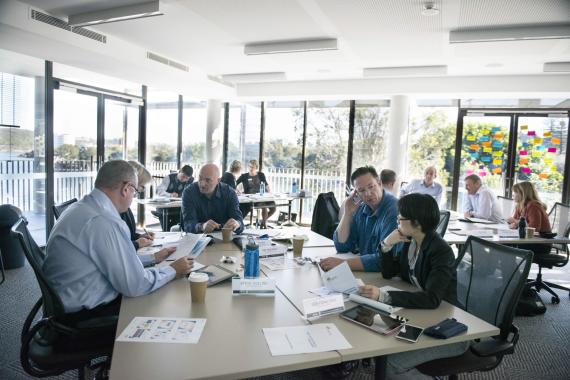AIPM Venue - People working at desks
