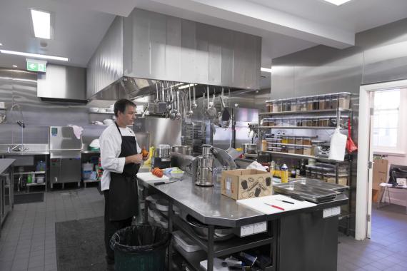 AIPM Venue - photo of chef in the kitchen. Wide shot.