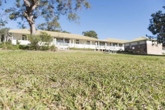 AIPM Venue - external photo of venue looking up from grass below